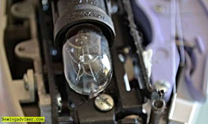 Installing a new light bulb in Singer sewing machine
